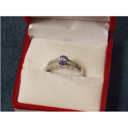 RING - OVAL FACETED TANZANITE & 2 DIAMOND IN STERLING SILVER SOLITAIRE SETTING - RETAIL ESTIMATE $35