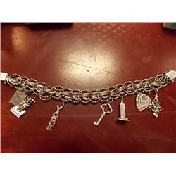 BRACELET- STERLING SILVER WITH 6 STERLING SILVER CHARMS