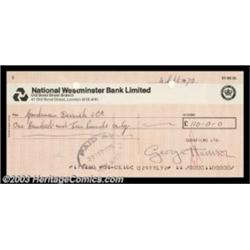 George Harrison - Signed Document An original signed corporate check drawn on one of the Beatle'