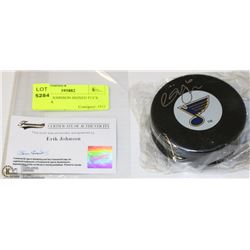 135) ERIK JOHNSON SIGNED PUCK WITH COA