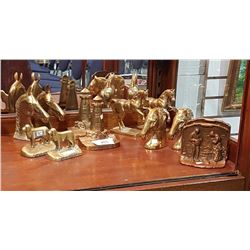SIX SETS OF BRASS BOOKENDS