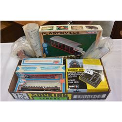 TWO TRAYS OF MODEL TRAIN TRACKS AND CARS