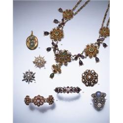 AN ANTIQUE RUBY AND DIAMOND CLUSTER BANGLE, CA. 1890 COMPOSED OF THREE GRADUATED OPENWORK CLUS