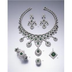 AN EMERALD AND DIAMOND PENDANT THE SQUARE SHAPED CUT CORNERED STEP-CUT EMERALD WEIGHING APP