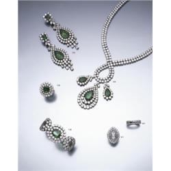 A DIAMOND ETERNITY RING CLAW SET THROUGHOUT WITH EMERALD-CUT DIAMONDS, MOUNTED IN PLATINUM, DI