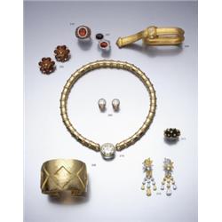 A PAIR OF CITRINE AND DIAMOND EARCLIPS DESIGNED AS A FLOWER HEAD SET WITH TWO TIERS OF OVAL SH