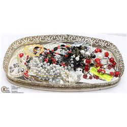MIRRORED TRAY FILLED WITH COSTUME JEWELRY