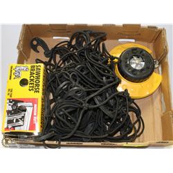 LOT WITH SPRINKLER, SAW HORSE, AND CARGO NET