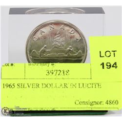 1965 SILVER DOLLAR IN LUCITE