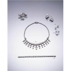 KERN A DIAMOND BROOCH, CA. 1950 DESIGNED AS A STYLIZED FLORAL SPRAY COMPOSED OF BRILLIAN