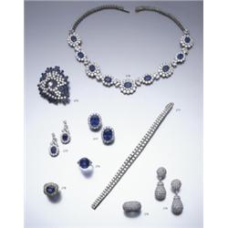 A SAPPHIRE AND DIAMOND RING THE OVAL SHAPED SAPPHIRE WEIGHING APPROXIMATELY 16.80 CARATS CL