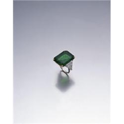 CARTIER A HIGHLY IMPORTANT EMERALD AND DIAMOND RING, CA. 1970 THE RECTANGULAR-CUT EMERAL