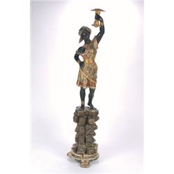AN ANTIQUE CARVED, AND PAINTED WOOD BLACKAMOOR FIGURE, with arm outstretched and standing on a...