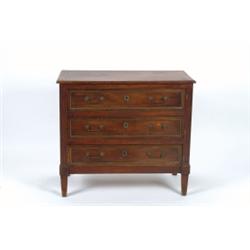 AN EARLY 19TH CENTURY FRENCH STRAIGHT-FRONT COMMODE, in the Empire, manner, fitted three long d...