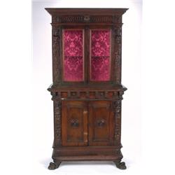 A LATE 17TH CENTURY, ITALIAN WALNUT CABINET, the upper section having two full length glazed do...