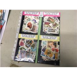 Four packages/1 page of more then 100 worldwide stamps, new and used