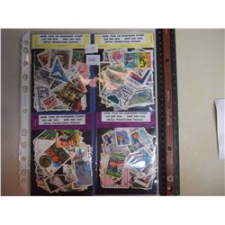 Four packages/1 page of more then 100 worldwide stamps, new and used