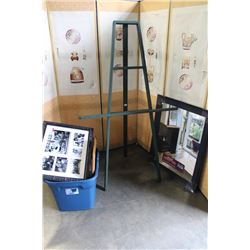 EASEL AND TOTE OF PICTURES