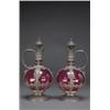Image 1 : PAIR OF CONTINENTAL PEWTER MOUNTED RED GLASS CARAFES, of globular form with moulded scroll handle...