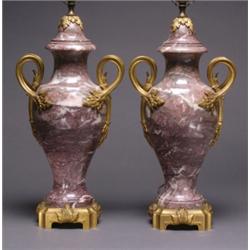 PAIR OF FRENCH ORMOLU MOUNTED PURPLE MARBLE TABLE LAMPS, of ovoid shape with bifurcated foliate h...