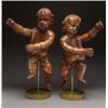 Image 1 : PAIR OF CONTINENTAL CARVED OAK FIGURES OF PUTTI, mounted on plain, circular brass bases, ht. 24...
