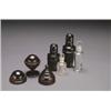 Image 1 : TWO TURNED EBONY, TRAVELLING BOTTLE CASES AND A LIGNUM VITAE MAGIC GAME, the cases enclosing mo...
