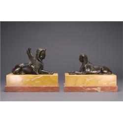 PAIR OF FRENCH PATINATED BRONZE SPHINXES, each, modelled as a recumbent sphinx, one with wings,...