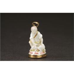 CHELSEA MINIATURE SEAL FIGURE OF A SHEPHERD, modelled and painted in colours and gilt, the kneeli...