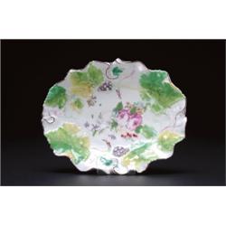 CHELSEA OVAL DISH,, moulded with fruiting vines painted in colours around a bouquet of garden f...