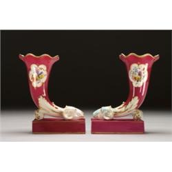 PAIR OF ENGLISH, PORCELAIN SPILL VASES, moulded as cornucopia with ram's head terminals on plin...