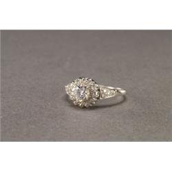 PLATINUM FILIGREE RING, set with a European cut diamond (approx. 0.50ct.) in a mount, decorated...