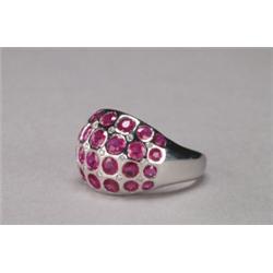 18K WHITE GOLD RING, set with 28 full cut rubies (approx. 4.02ct. total weight) in a domed mount...