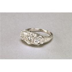 PLATINUM FILIGREE RING, set with 3 brilliant cut diamonds (approx. 1.08ct. total weight) in an or...