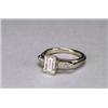 Image 1 : 18K WHITE GOLD SOLITAIRE RING, set with an emerald cut diamond (approx. 1.27ct.) flanked by 2 sma...