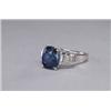 Image 1 : PLATINUM COCKTAIL RING, set with a fine oval cut sapphire (approx. 5.81ct.) flanked by 6 baguette...