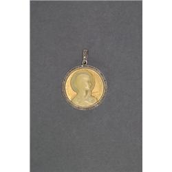 FRENCH 18K YELLOW GOLD AND PLATINUM CIRCULAR PENDANT, set with a carved ivory cameo of Mary withi...