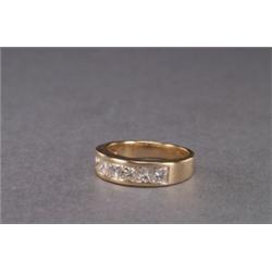 14K YELLOW GOLD BAND, channel set with 6 princess cut diamonds (approx. 1.20ct. total weight), 3....