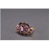 Image 1 : 14K YELLOW GOLD, COCKTAIL RING, set with 17 various cut amethysts and, decorated with 2 small...
