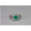 Image 1 : PLATINUM COCKTAIL RING, set with an emerald cut emerald (0.90ct.) encircled by 12 brilliant cut d...