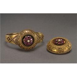 VICTORIAN 14K YELLOW GOLD HINGED BANGLE, set with 6 heart cut garnets and a small pearl and decor...