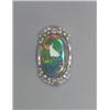 Image 1 : BIRKS PLATINUM BROOCH, set with an oval black opal slab (27.0mm x 17.2mm x 3.75mm) encircled by 1...