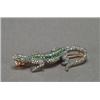 Image 1 : 14K PINK GOLD AND SILVER BROOCH, realistically formed as a lizard and set with 35 small full cut...