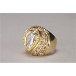 14K YELLOW GOLD RING, bezel set with a pear cut diamond (approx. 2.05ct.) in a stepped mount deco...