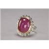 Image 1 : 18K YELLOW AND WHITE GOLD COCKTAIL RING, bezel set with a large oval ruby cabochon (approx. 20.0c...