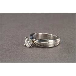 PLATINUM SOLITAIRE RING, set with a brilliant cut diamond (approx. 1.02ct.) in a mount with incis...