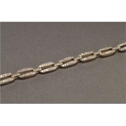 14K YELLOW GOLD AND, SILVER BRACELET, formed of connected oval links and set with 198 brilliant...
