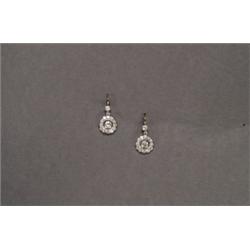 PAIR OF PLATINUM AND 18K YELLOW GOLD HOOK BACK DROP EARRINGS, each formed as a stylized flowerhea...