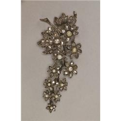 SILVER AND 9K YELLOW GOLD BROOCH, formed as a flowered branch and set with 119 rose cut diamonds...