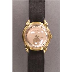 MEN'S A.E.C. WATCH CO. WRISTWATCH, circa 1948; 15 jewel movement; black Roman and gold disc numer...