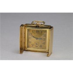 TAVANNES TRAVEL CLOCK, circa 1930; 15 jewel adjusted movement; luminous hands and Arabic numerals...